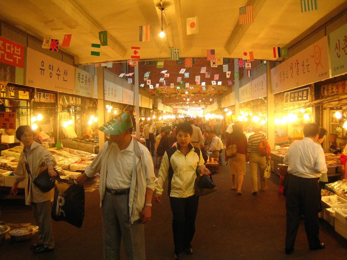 Stalls and shoppers in Gwangjang Market, Seoul, South Korea