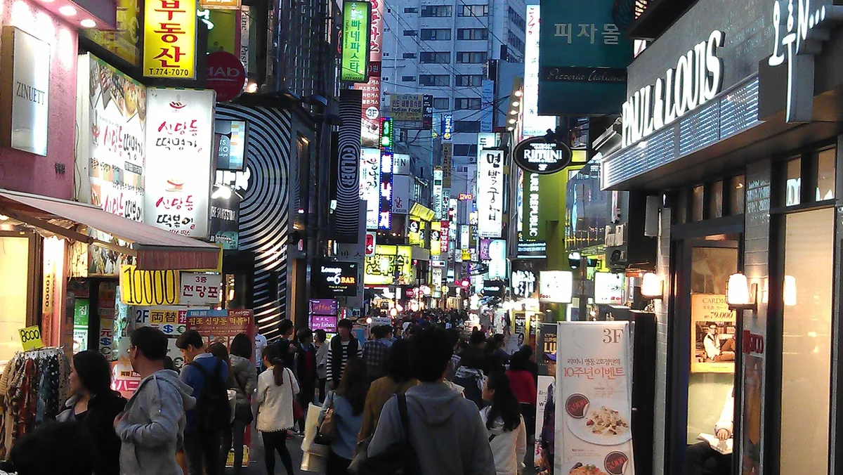 The main Myeongdong shopping street lit at night, Seoul, South Korea